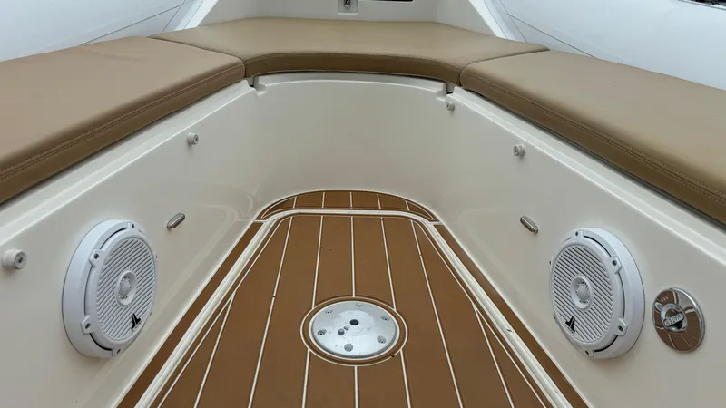 Slide: The Image of 2017 Nuova Jolly Princess boat interior with cushioned seating and marine speakers. - 12