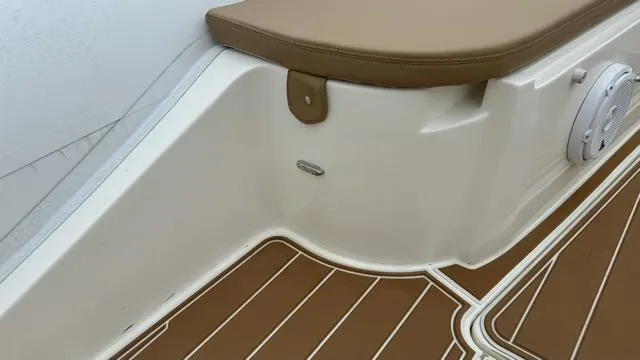 Slide: The Image of 2017 Nuova Jolly Princess boat interior with brown and white seating and flooring. - 13