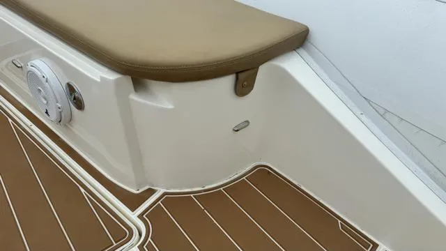 Slide: The Image of Nuova Jolly Princess 2017 boat interior with brown cushioned seating and wood-patterned flooring. - 14