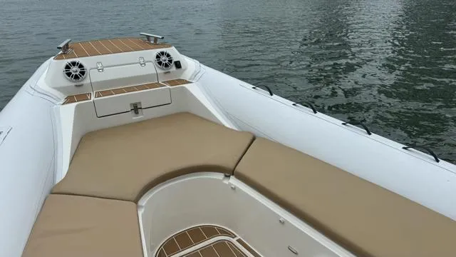 Slide: The Image of 2017 Nuova Jolly Princess boat interior with beige seating and water view. - 15