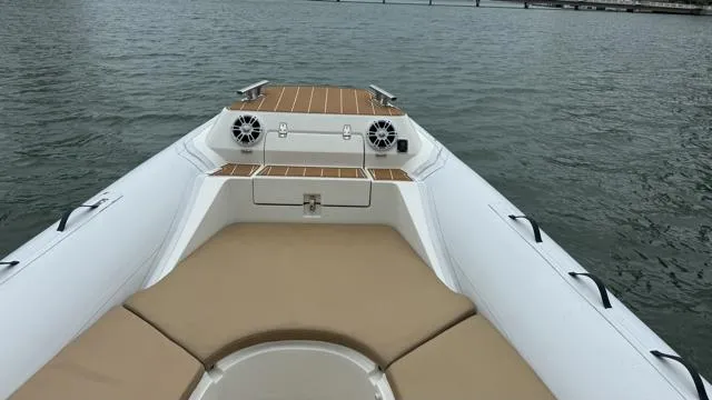 Slide: The Image of 2017 Nuova Jolly Princess boat with beige seating on calm water. - 17