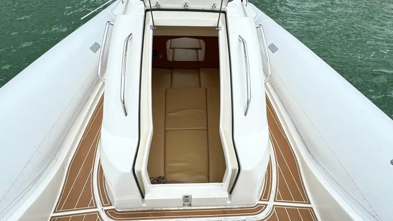 Slide: The Image of 2017 Nuova Jolly Princess boat interior with open hatch and teak flooring. - 20