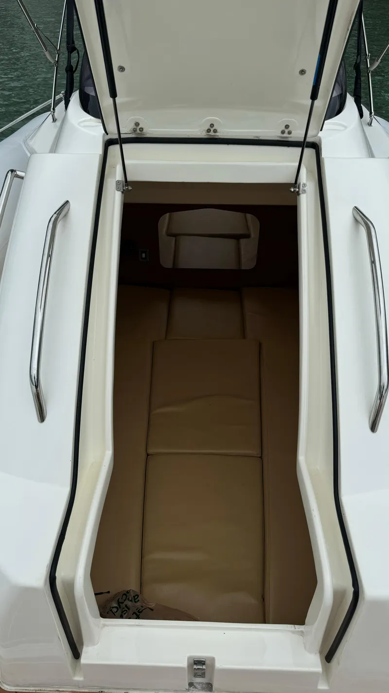 Slide: The Image of 2017 Nuova Jolly Princess boat cabin with open hatch and beige interior. - 21