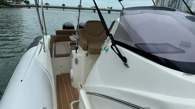 Slide: The Image of 2017 Nuova Jolly Princess boat with sleek design, docked on calm waters. - 23