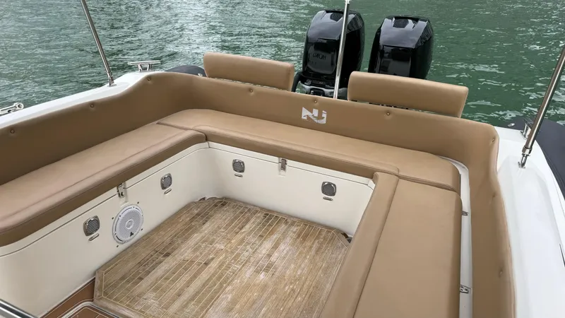 Slide: The Image of 2017 Nuova Jolly Princess boat interior with tan seating and twin engines. - 37