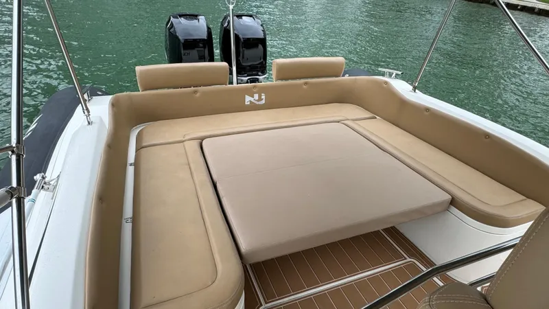Slide: The Image of 2017 Nuova Jolly Princess boat with beige seating and dual outboard motors. - 40