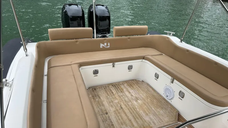 Slide: The Image of 2017 Nuova Jolly Princess boat with tan seating and dual outboard motors. - 41