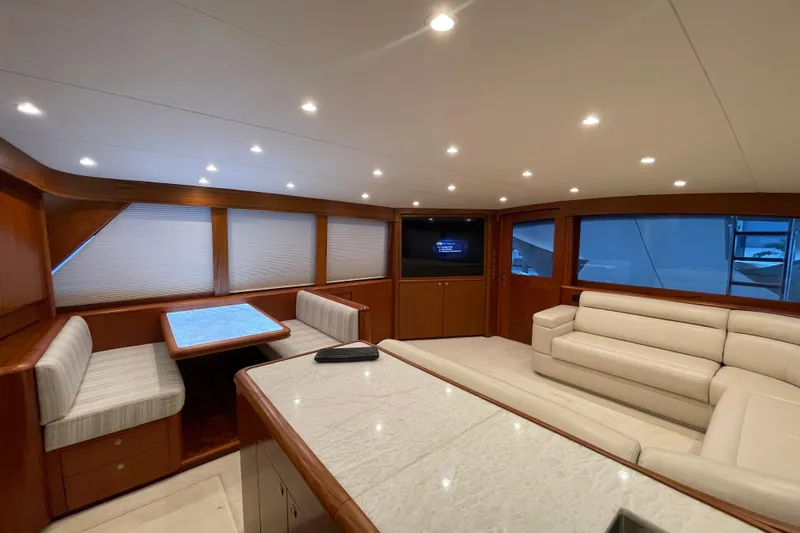 Slide: The Image of Luxurious interior of a 1999 Merritt Sportfish yacht with elegant seating and modern lighting. - 1