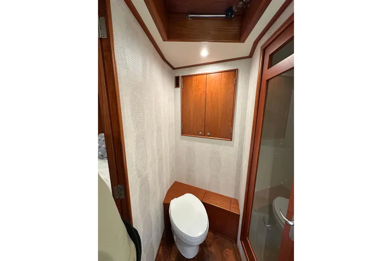 Slide: The Image of 1999 Merritt Sportfish bathroom interior with wooden cabinetry and modern fixtures. - 13