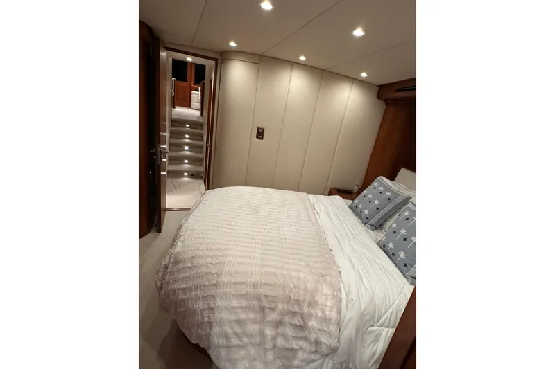 Slide: The Image of Luxurious bedroom interior of 1999 Merritt Sportfish yacht with elegant bedding. - 9