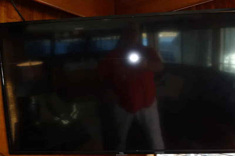 Slide: The Image of Reflection on a dark TV screen inside a 1977 Hatteras 53 Motor Yacht. - 110