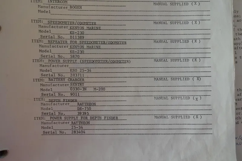 Slide: The Image of 1977 Hatteras 53 Motor Yacht equipment list: intercom, speedometer, odometer, battery charger, depth finder. - 116