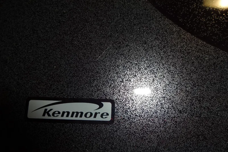 Slide: The Image of Kenmore appliance surface with textured pattern and reflective light. - 126