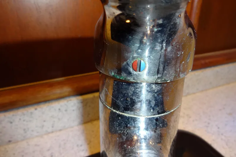 Slide: The Image of Close-up of a chrome faucet on a 1977 Hatteras 53 Motor Yacht. - 129