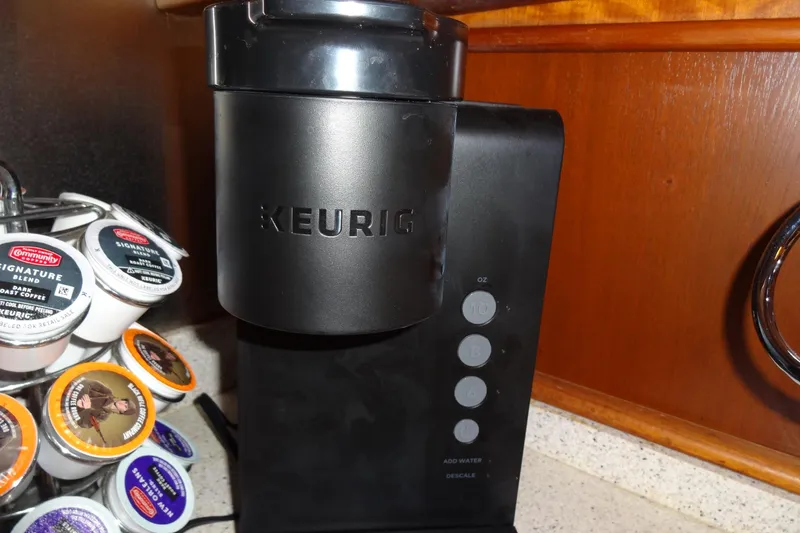 Slide: The Image of Keurig coffee maker with assorted K-Cups on a 1977 Hatteras 53 Motor Yacht. - 130