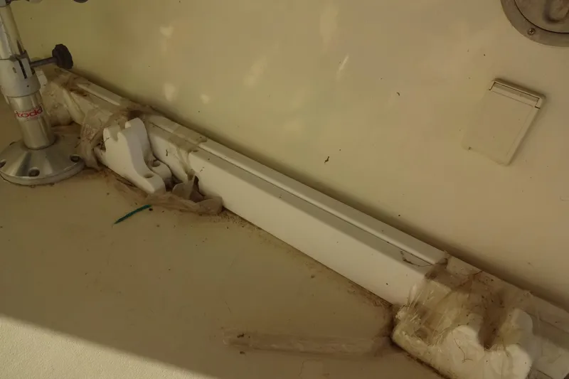 Slide: The Image of Interior detail of a 1977 Hatteras 53 Motor Yacht, showing a mounted fixture and wiring. - 132