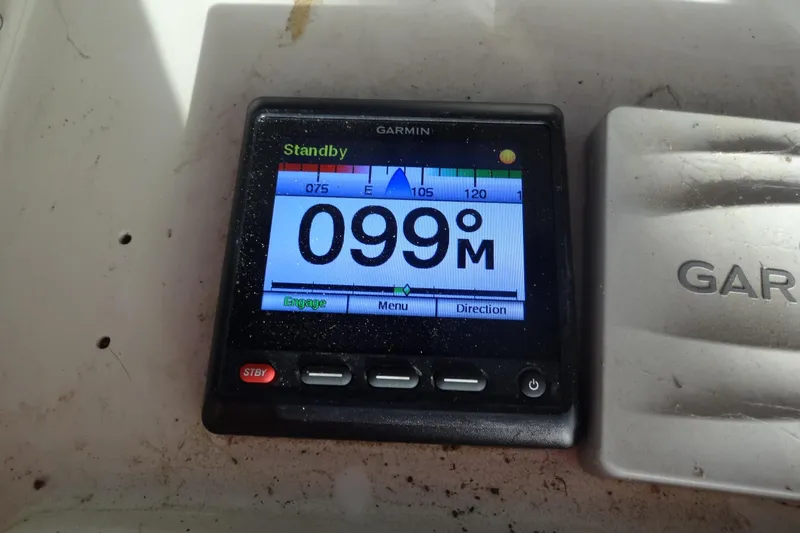 Slide: The Image of Garmin display on 1977 Hatteras 53 Motor Yacht showing 099 meters in standby mode. - 134