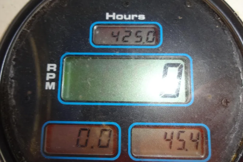 Slide: The Image of Digital gauge displaying 4250 hours and 0 RPM on a 1977 Hatteras 53 Motor Yacht. - 136