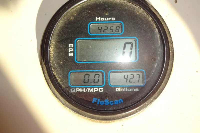 Slide: The Image of Digital gauge display on 1977 Hatteras 53 Motor Yacht showing hours, RPM, and fuel data. - 137