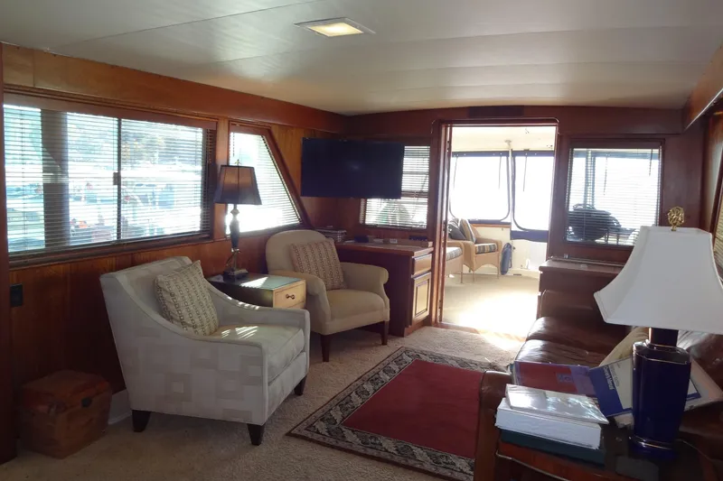 Slide: The Image of Interior of 1977 Hatteras 53 Motor Yacht with cozy seating and elegant decor. - 17