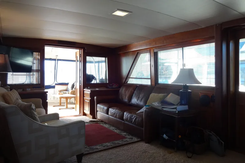 Slide: The Image of Interior of 1977 Hatteras 53 Motor Yacht with cozy seating and natural light. - 18