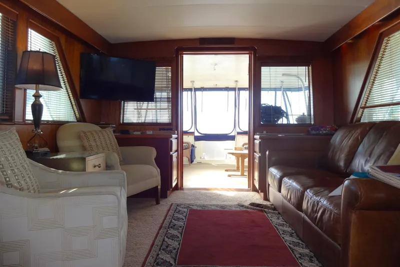 Slide: The Image of Interior of a 1977 Hatteras 53 Motor Yacht with elegant seating and decor. - 20