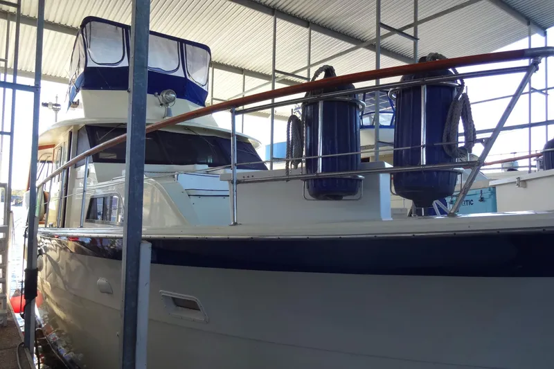Slide: The Image of 1977 Hatteras 53 Motor Yacht docked in a covered marina. - 3