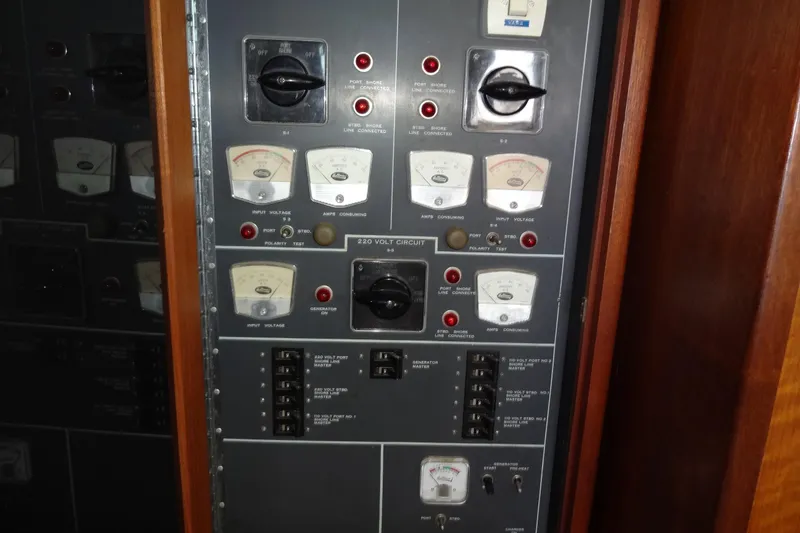 Slide: The Image of Electrical control panel on a 1977 Hatteras 53 Motor Yacht, featuring gauges and switches. - 30