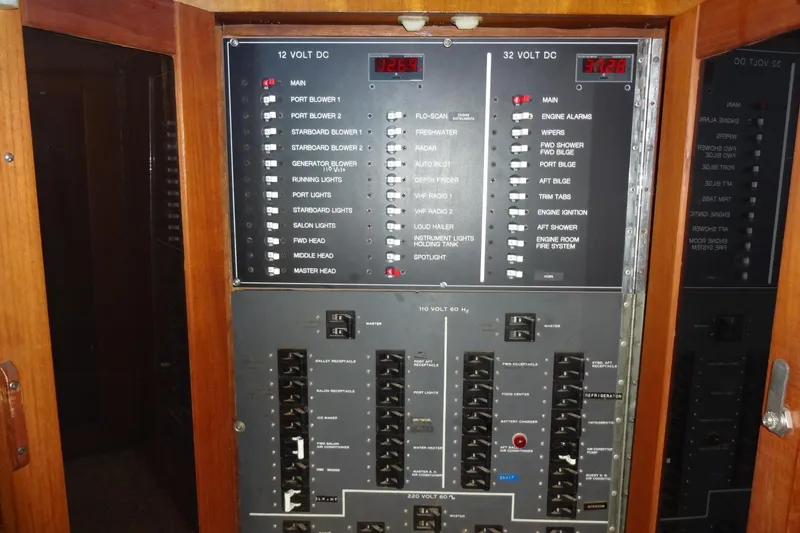 Slide: The Image of Electrical control panel on a 1977 Hatteras 53 Motor Yacht, featuring various switches and indicators. - 31