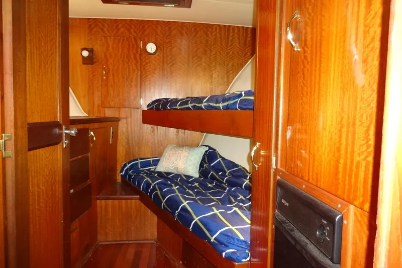 Slide: The Image of Interior cabin of 1977 Hatteras 53 Motor Yacht with wooden finish and bunk beds. - 39