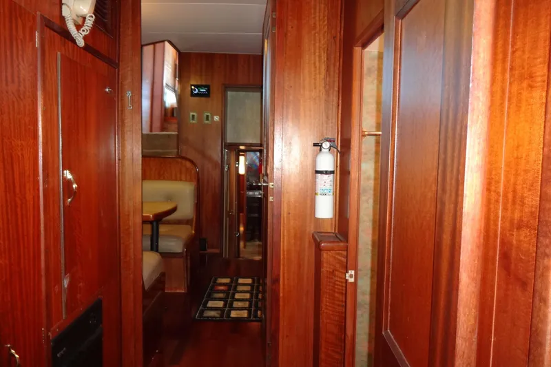 Slide: The Image of Interior of 1977 Hatteras 53 Motor Yacht with wood paneling and seating area. - 46