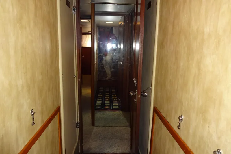 Slide: The Image of Interior hallway of a 1977 Hatteras 53 Motor Yacht with wood paneling. - 50