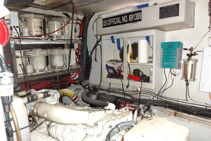 Slide: The Image of Engine room of 1977 Hatteras 53 Motor Yacht with equipment and wiring. - 74