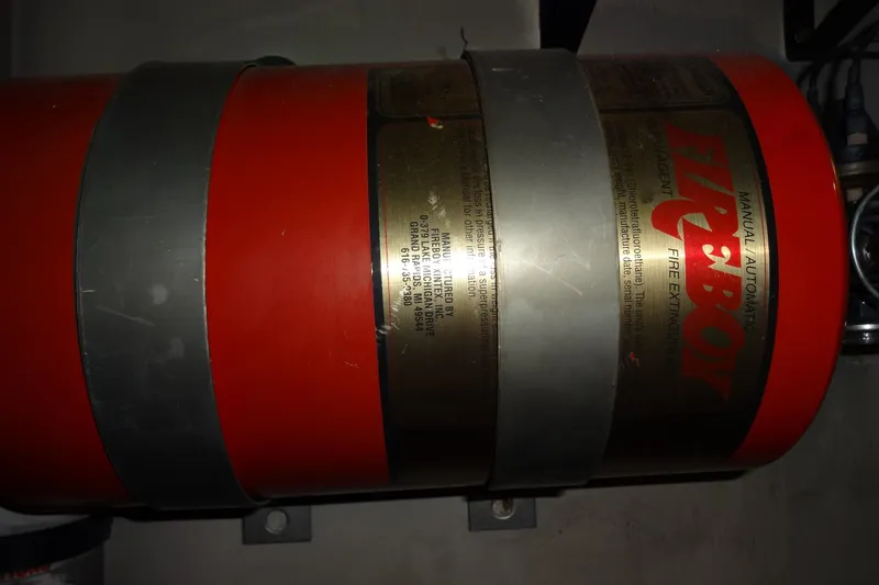 Slide: The Image of Fire extinguisher on 1977 Hatteras 53 Motor Yacht, red cylinder with metal straps. - 79