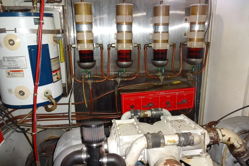 Slide: The Image of Engine room of 1977 Hatteras 53 Motor Yacht with fuel filters and water heater. - 85