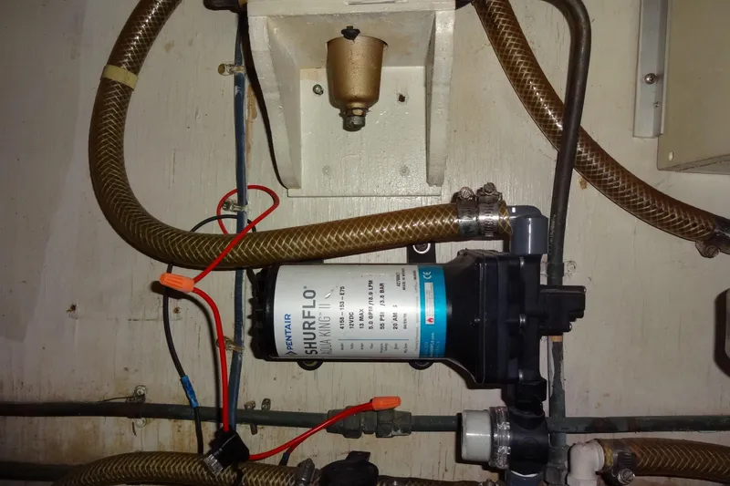 Slide: The Image of Water pump system in a 1977 Hatteras 53 Motor Yacht engine room. - 90