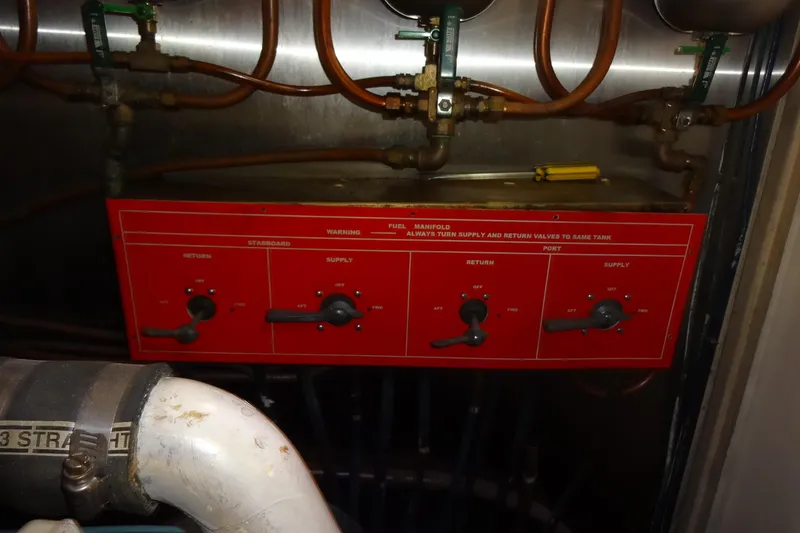 Slide: The Image of Fuel manifold controls on a 1977 Hatteras 53 Motor Yacht engine room. - 91