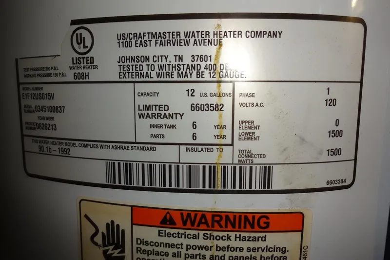 Slide: The Image of Label on water heater showing specifications and warning, Hatteras 53 Motor Yacht 1977. - 93