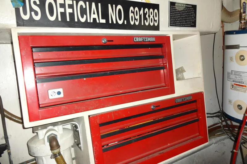 Slide: The Image of Red Craftsman toolboxes on a 1977 Hatteras 53 Motor Yacht with official number. - 95