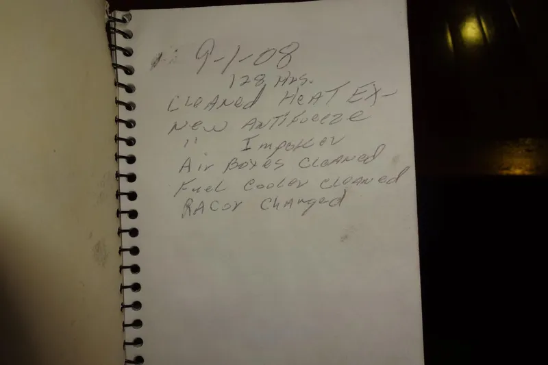 Slide: The Image of Notebook with handwritten maintenance notes for a 1977 Hatteras 53 Motor Yacht. - 96