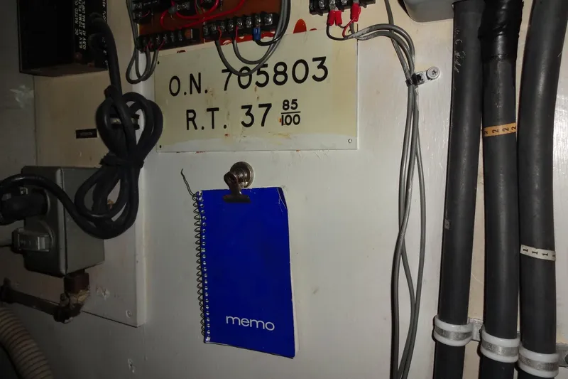 Slide: The Image of Electrical panel and memo pad on 1977 Hatteras 53 Motor Yacht. - 98