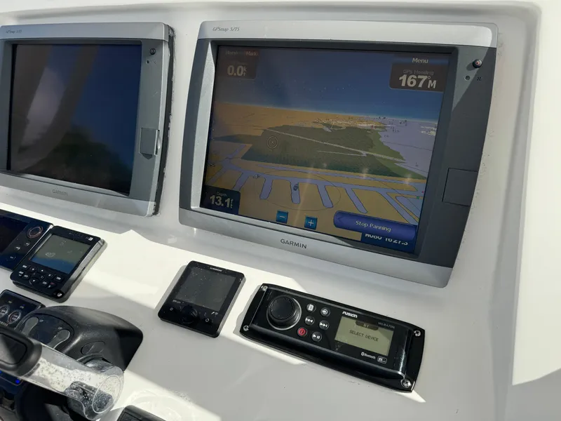Slide: The Image of Control panel of a 2014 Intrepid 327 Center Console with Garmin navigation displays. - 6