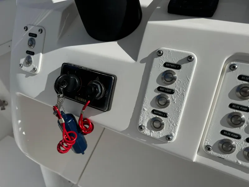 Slide: The Image of Control panel of a 2014 Intrepid 327 Center Console boat with ignition keys. - 7