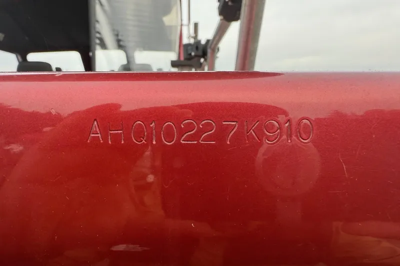 Slide: The Image of 2010 Thunder Jet 21 Luxor OB boat interior with Humminbird equipment and anchor storage. - 13