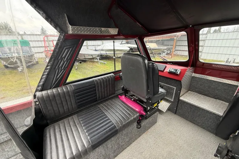 Slide: The Image of Interior of 2010 Thunder Jet 21 Luxor OB boat with steering console and seating. - 20