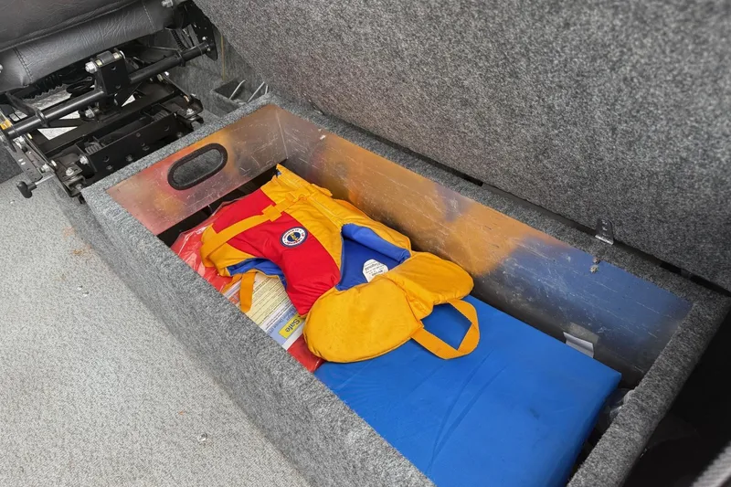 Slide: The Image of Interior of 2010 Thunder Jet 21 Luxor OB boat with black seating and red accents. - 21