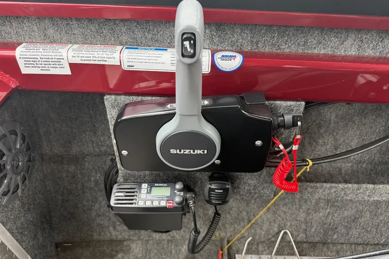 Slide: The Image of Interior of 2010 Thunder Jet 21 Luxor OB boat with steering wheel and controls. - 24