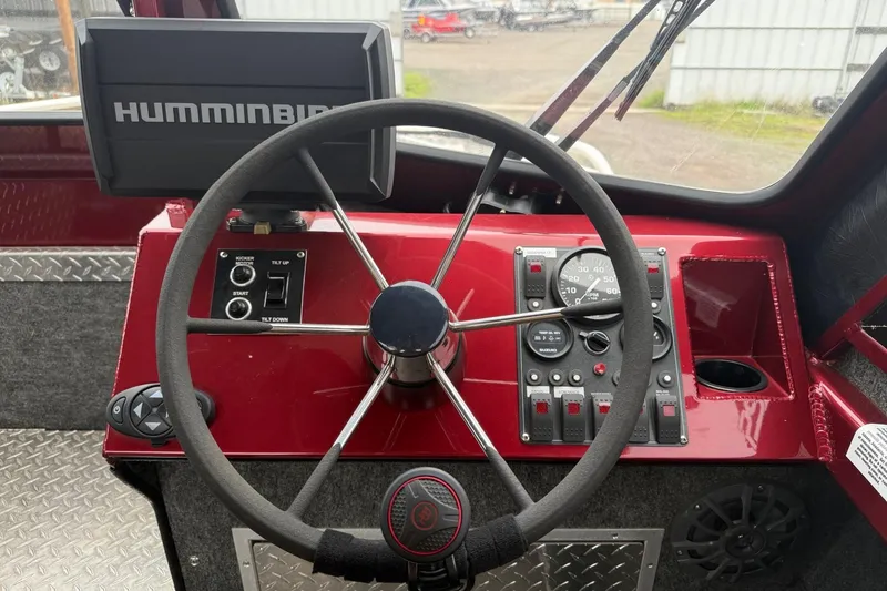 Slide: The Image of Steering console of a 2010 Thunder Jet 21 Luxor OB boat with Humminbird electronics. - 28