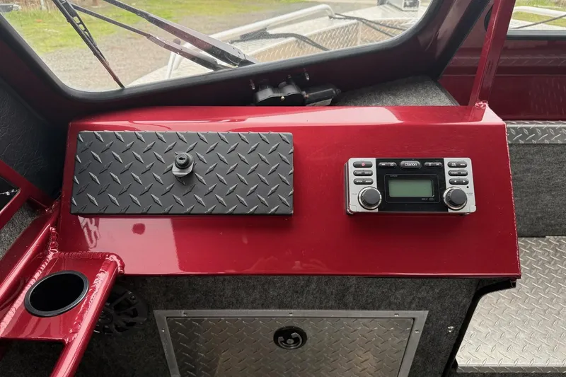 Slide: The Image of Dashboard of a 2010 Thunder Jet 21 Luxor OB boat with gauges and switches. - 29