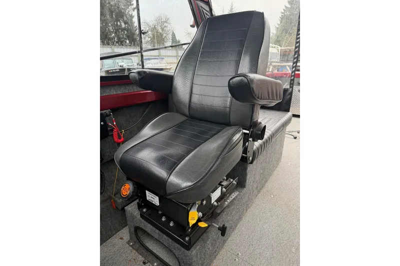 Slide: The Image of Interior of 2010 Thunder Jet 21 Luxor OB boat with red dashboard and radio controls. - 32